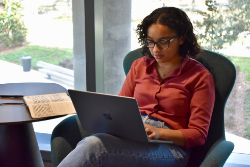 USF Honors student Avani Sanghvi works on the second floor of the Judy Genshaft Honors College.