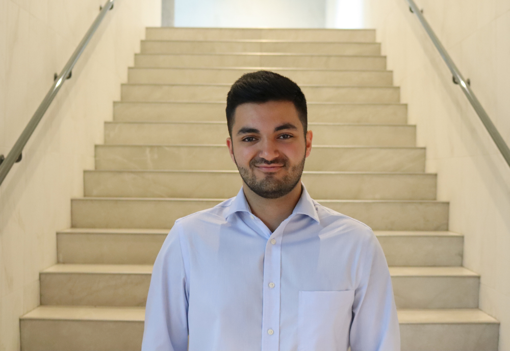 USF Student Christoper Oueis poses in the Judy Genshaft Honors College building.