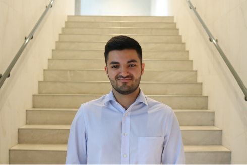 USF Student Christoper Oueis poses in the Judy Genshaft Honors College building.