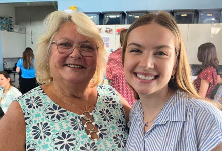 Marza Hiatt and Professor Hansen smile together in a classroom.