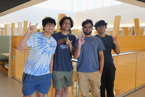 Jacob Delikat, Jude Delikat, Tehmani Ammad, and Muntahie Ammad posing in Honors Atrium