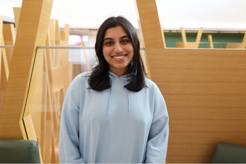 Headshot of Neha Dantuluri smiling in the Judy Genshaft Honors College building