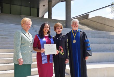 PBK 2024 inductee poses with President Rhea Law, Dean Adams, and President Emerita Judy Genshaft outside Honors Building