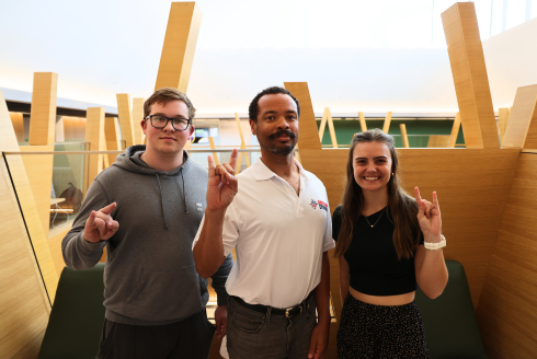 Photo of Honors students Nick Nechaiev and Tyler Briggs with Dr. Cross at the Honors College.