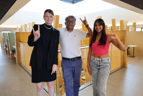 Honors affiliate faculty member Deepak Singh poses with Honors students Amelie McLeod and Daniella Charco in the Judy Genshaft Honors College