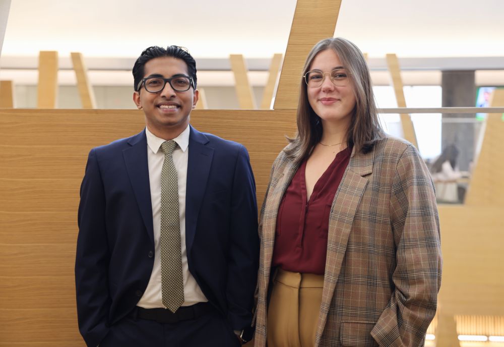 Alvin Varghese and Claire Kooy pose together in the Honors building