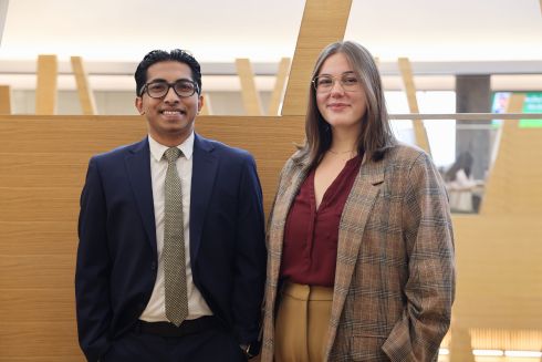 Alvin Varghese and Claire Kooy pose together in the Honors building