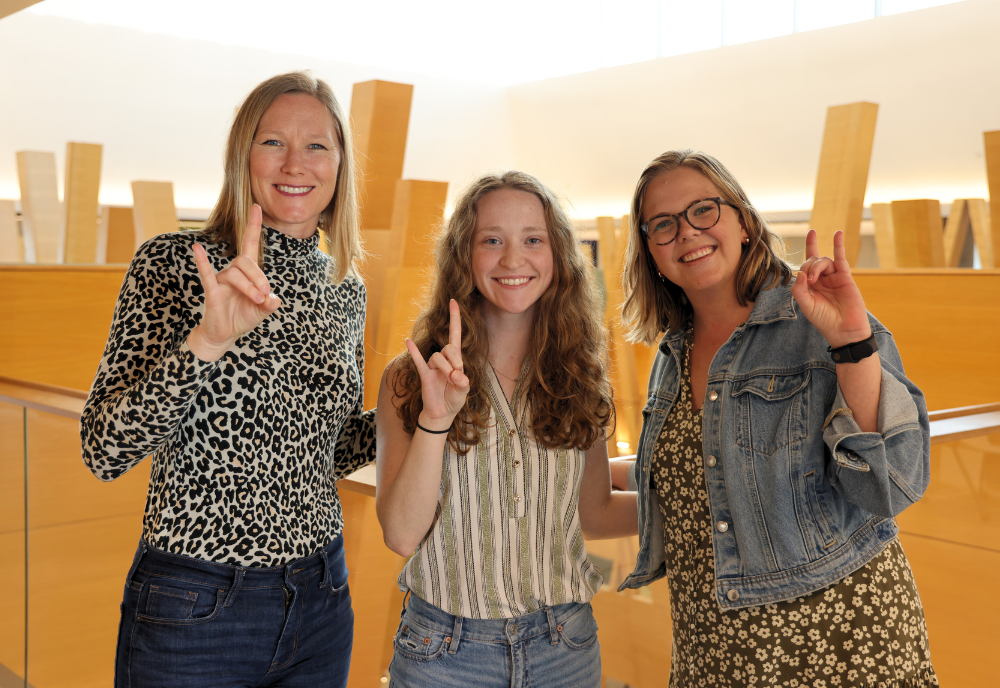 NMS Coordinator Audra Santerre, Honors student Rachel Weitz, and Honors affiliate faculty member Melanie Ryerson pose in the Honors building.