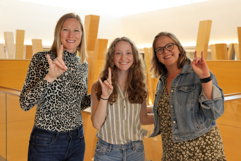 NMS Coordinator Audra Santerre, Honors student Rachel Weitz, and Honors affiliate faculty member Melanie Ryerson pose in the Honors building.