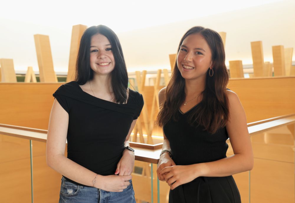 2025 USF Climate-Teach In student leaders Maia Ryan and Katelynn Paciorek smiling in the Honors building.