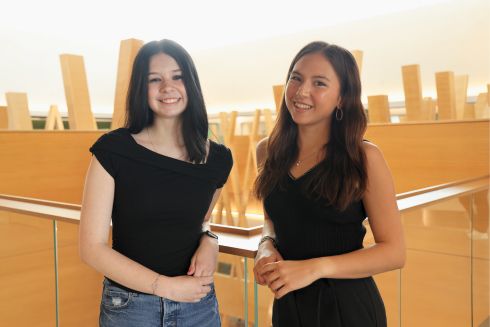 2025 USF Climate-Teach In student leaders Maia Ryan and Katelynn Paciorek smiling in the Honors building.