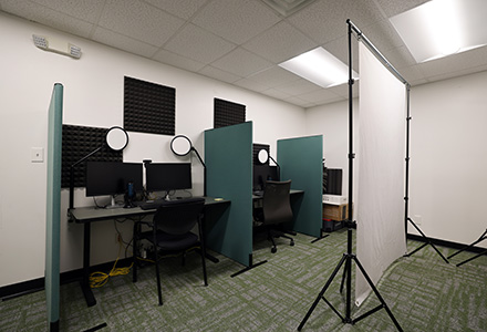 2 computers and white backdrop in faculty production room