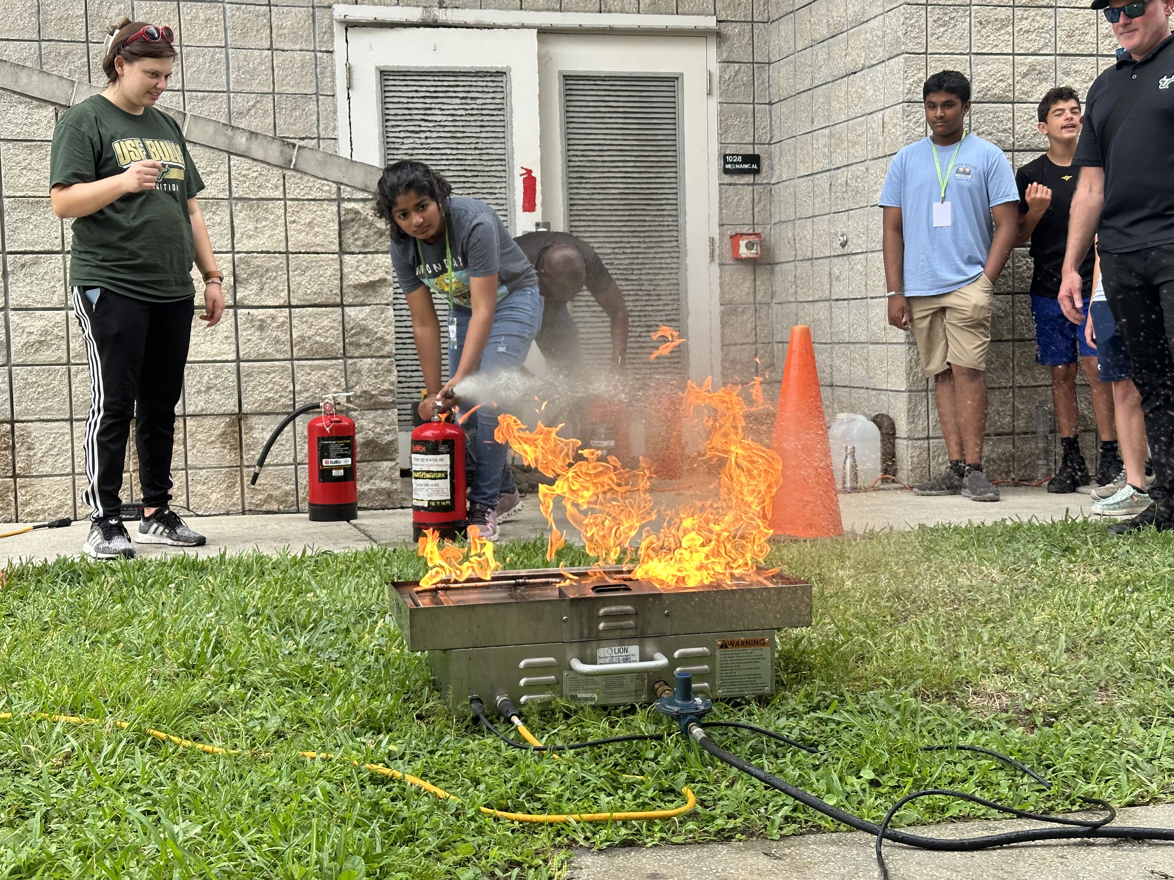 Bulls Disaster Campers using a fire extinguisher