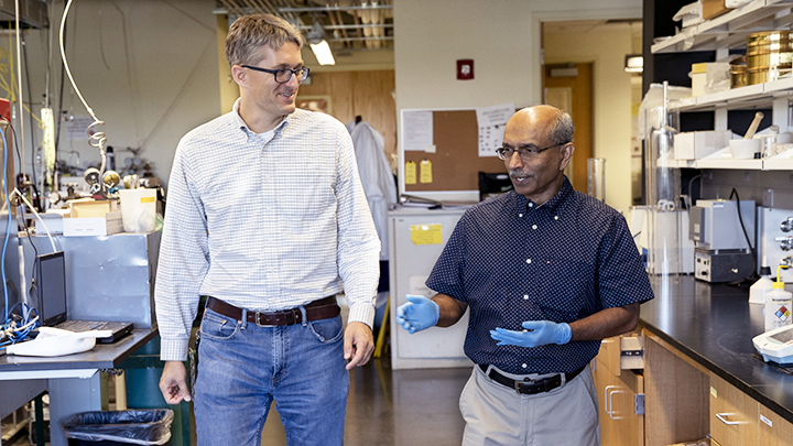 Professor Kuhn and Joseph in the lab