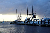 A fall squall moves over the docks at Mayport, Florida, in mid-November. Local authorities have vowed to expand the village's waterfront to bolster a struggling fishing fleet.