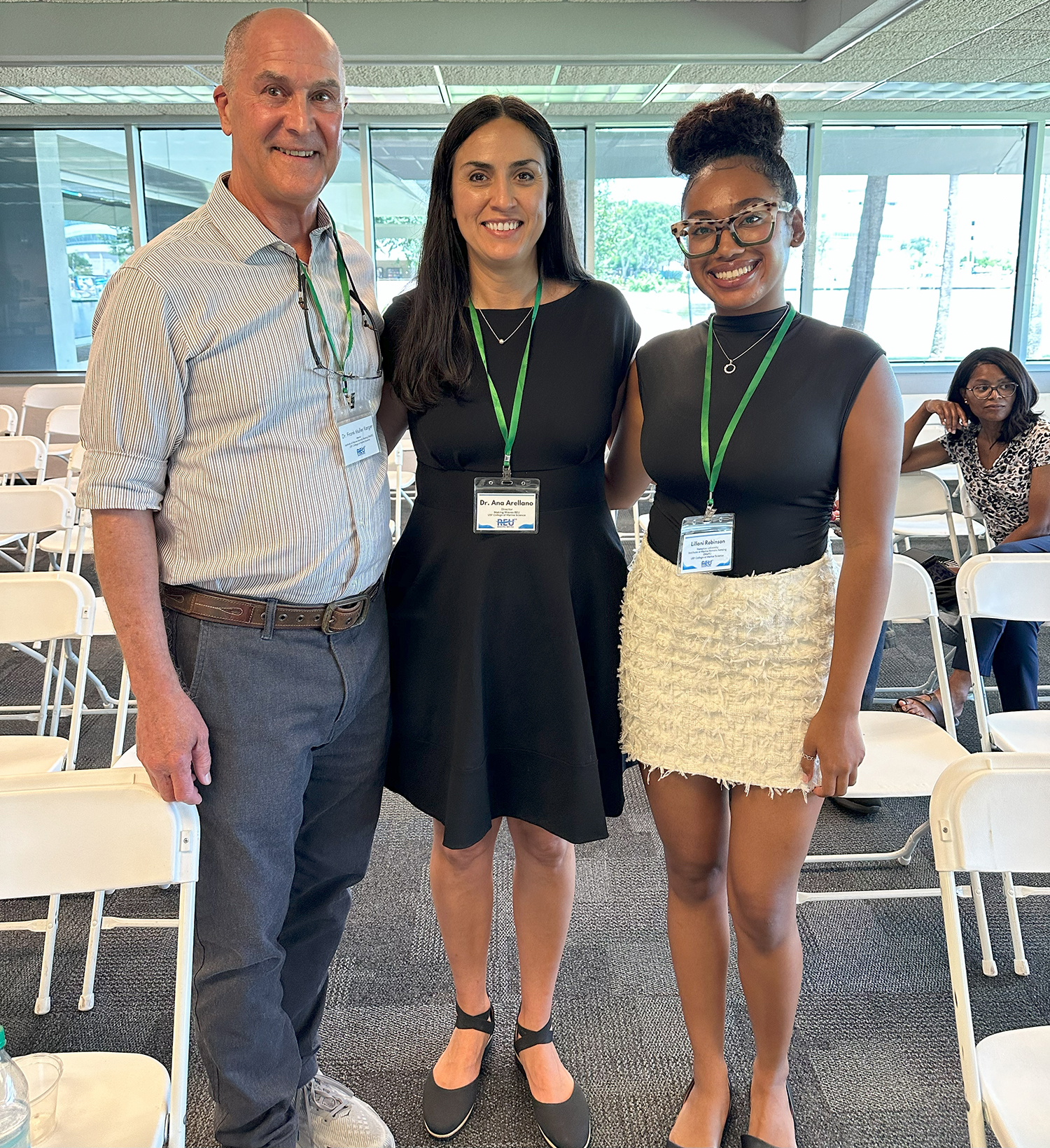 Ana Arellano, principal investigator of the Making Waves REU program, and Lillani Robinson, an REU scholar, pose for a photo with the keynote speaker Frank Müller-Karger, a Distinguished University Professor at the USF College of Marine Science. Photo Credit: Jess Van Vaerenbergh