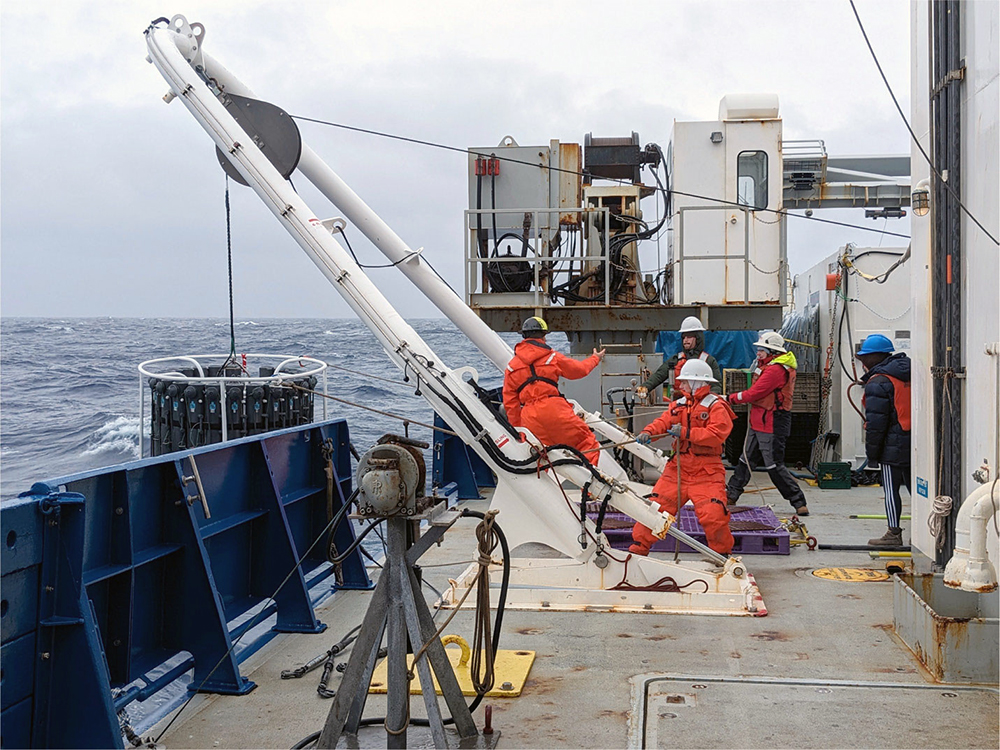 GEOTRACES has been an international effort involving hundreds of scientists and more than 150 research cruises. Here, crew members aboard the R/V Roger Revelle, including CMS graduate student Dylan Halbeisen, recover a GEOTRACES carousel rosette during an arctic cruise. Photo credit: Jennifer Middleton, Lamont-Doherty Earth Observatory.