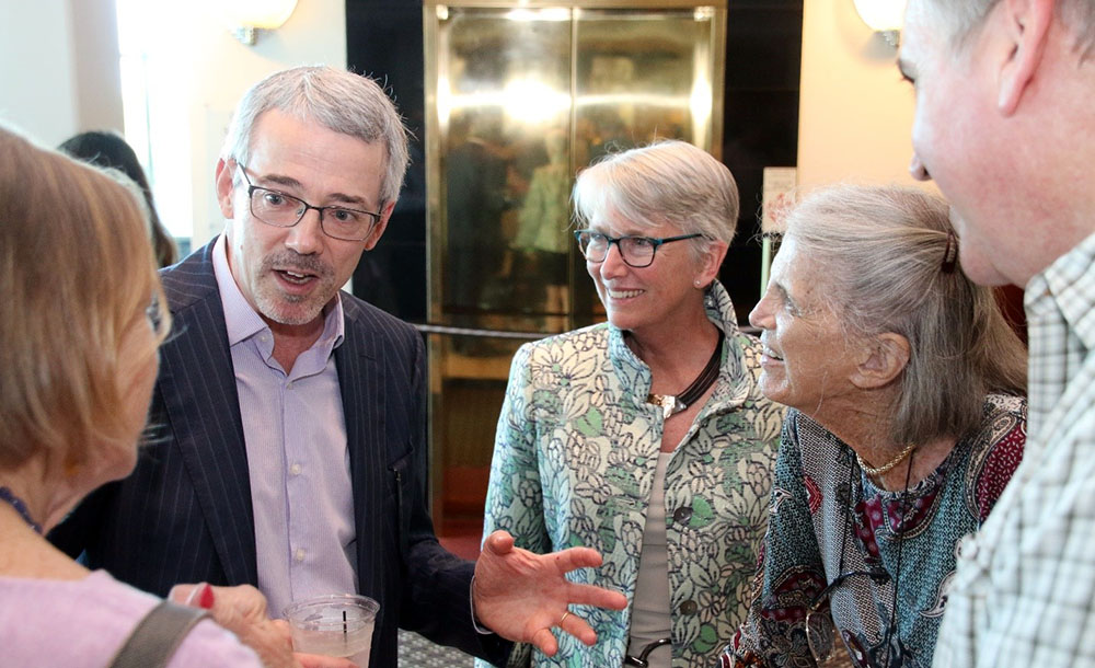 David Mearns speaks with the Dean of CMS, Dr. Jacqueline Dixon (center), and with Anne Von Rosenstiel (second from right) and family members at the reception preceding the event. 