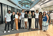 The Making Waves cohort celebrates after presenting their research posters at the USF St. Petersburg Undergraduate Research Symposium at the Nelson Poynter Memorial Library.