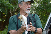 Gabe Vargo with a rehabilitated raptor.  Photo credit: J. Clayton