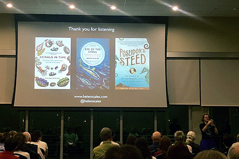 Dr. Helen Scales, bottom right, poses with a slideshow of three of her books.