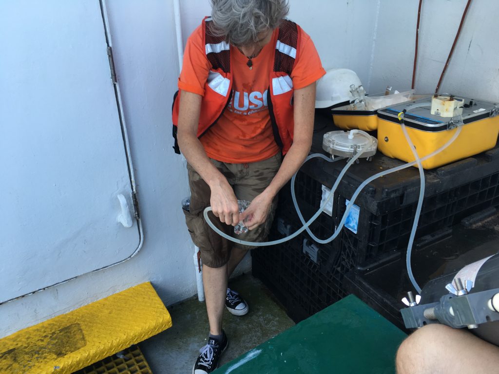 Dr. Kimberly Yates of the USGS samples filtered seawater for immediate analysis of pH in the ships laboratory.