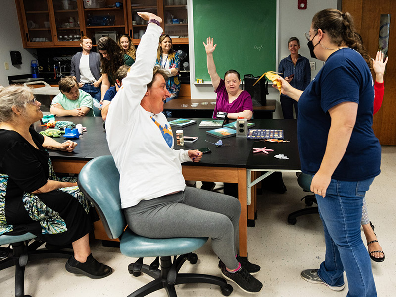 Mya Breitbart leads the Creative Clay members in an activity creating marine organisms out of origami. Image credit: Sheila Cowley.