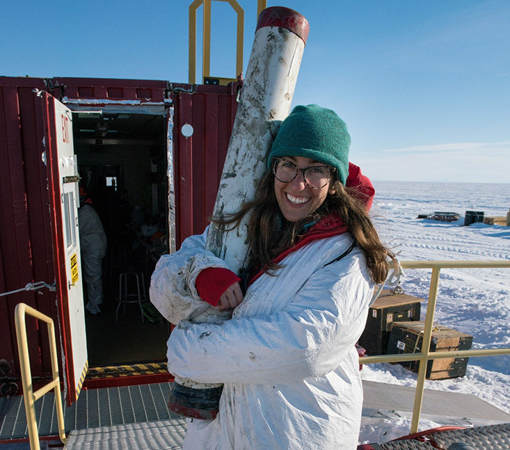 Ryan Venturelli, USFCMS Ph.D. student, holds the first ever gravity core from a subglacial lake.  Photo Credit:  Billy Collins, SALSA