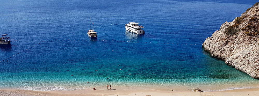 Skeletons and shells from an invasive species of foraminifera are helping build beaches like this one in the eastern Mediterranean Sea.