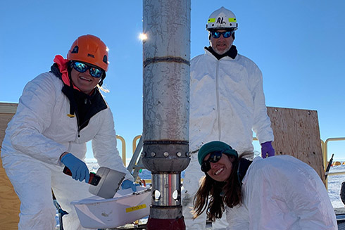 Subglacial Antarctic Lake Scientific Access team members Molly Patterson, Al Gagnon, and Ryan Venturelli (left to right) working with the gravity corer. Photo Credit: Kathy Kasic