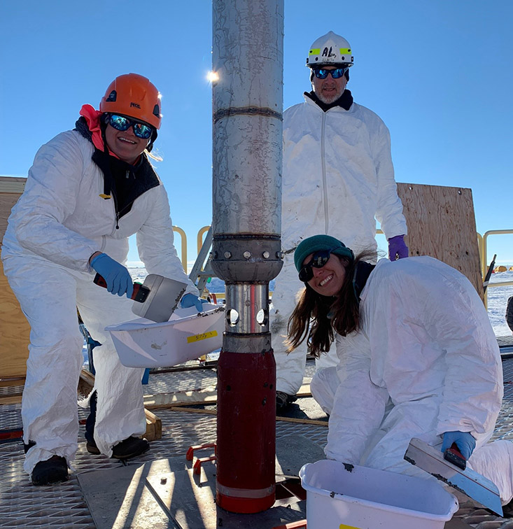 Subglacial Antarctic Lake Scientific Access team members Molly Patterson, Al Gagnon, and Ryan Venturelli (left to right) working with the gravity corer. Photo Credit: Kathy Kasic