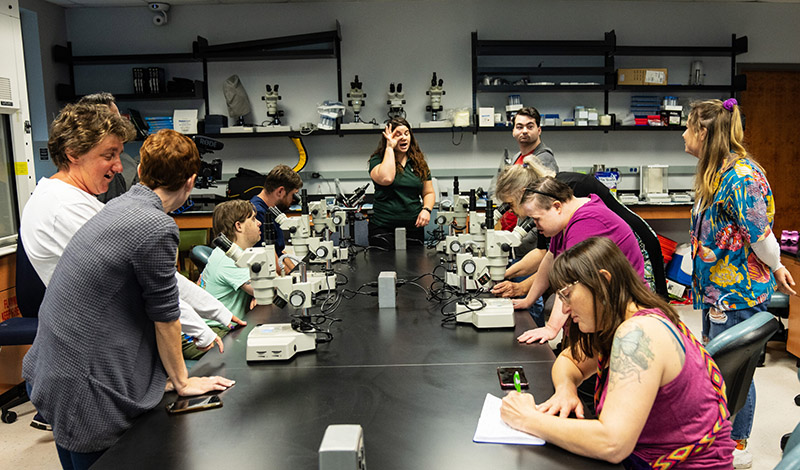 Led Makenzie Kerr, Breitbart Lab manager and outreach coordinator for CMS, members from Creative Clay observe plankton under microscopes. Image credit: Sheila Cowley