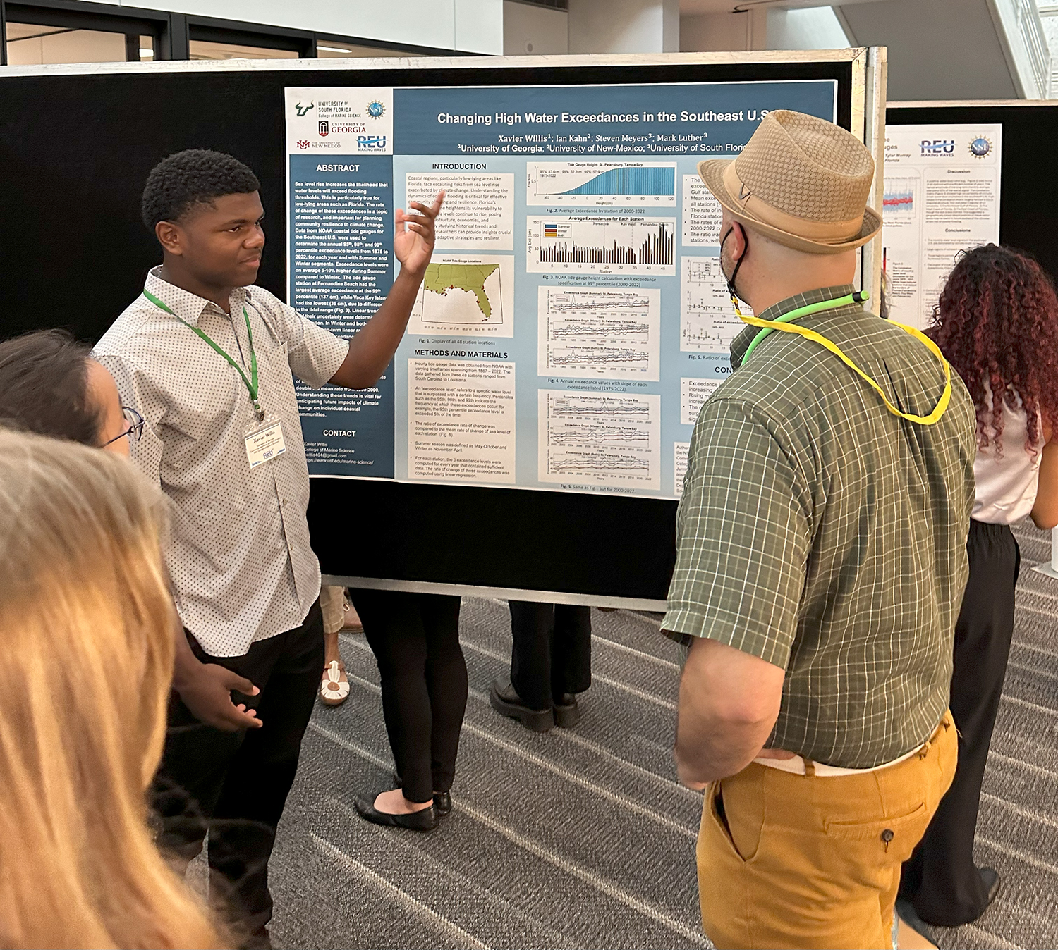 REU scholar Xavier Willis discusses his research on changing high water exceedances in the Southeast U.S. with Brad Rosenheim, professor of geological oceanography. Photo Credit: Jess Van Vaerenbergh