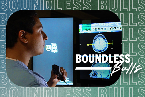 Zayn Mohamed looking at a screen showing an MRI scan. Text says, Boundless Bulls.