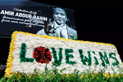 Graphic with a photo of Amir Abdur-Rahim with a flower arrangement that says 