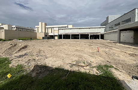 Dirt lot in front of a building