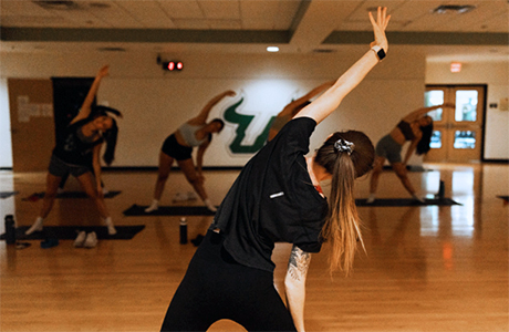 Students partake in a yoga class at the USF Rec Center