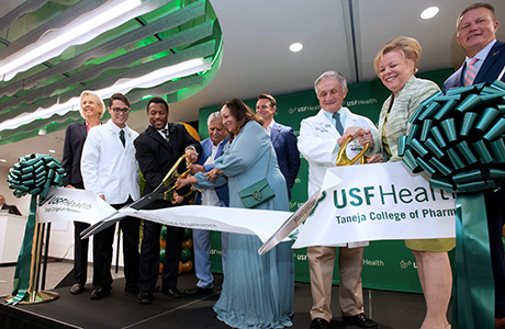 A ribbon being cut inside the USF Waterstreet Tampa building