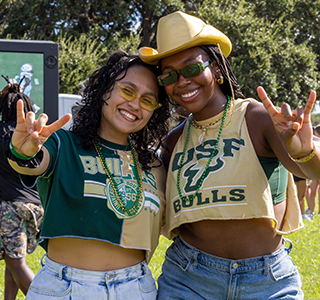 Two students give the Go Bulls hand signal