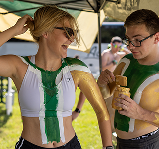 Students put on body paint