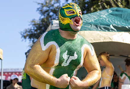 Student wears body paint while tailgating