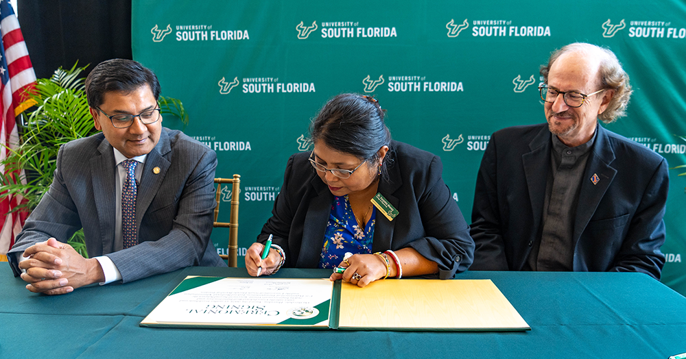 Amit Bose, administrator of the Federal Railroad Administration, Dean Sanjukta Bhanja, interim dean of the USF College of Engineering and Fred Mannering, executive director of CUTR