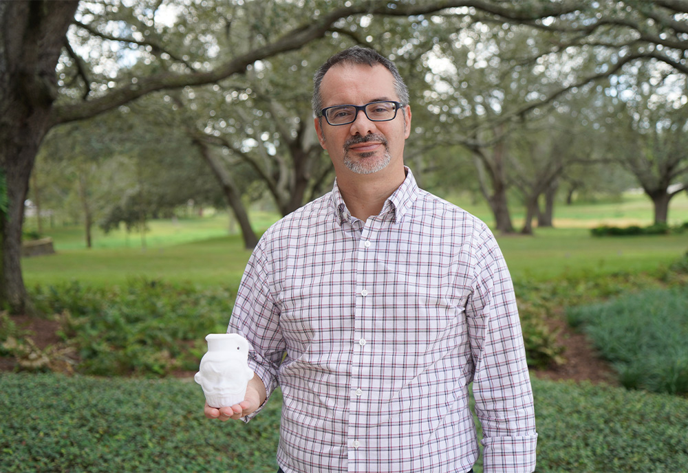 Davide holding the 3D printed replica of the mug