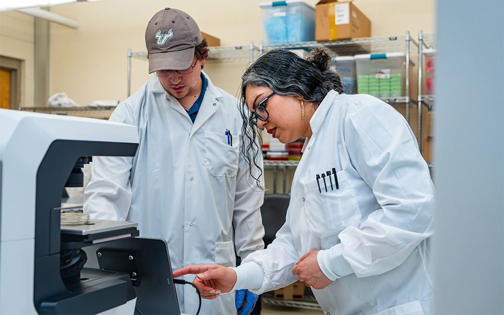 Neda Latifi and Russel Kramer in a research lab