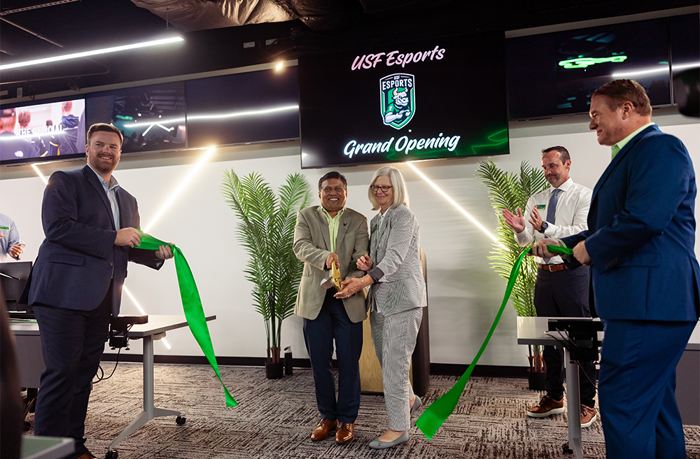 Provost Prasant Mohapatra and Cindy DeLuca cut the ribbon at the grand opening