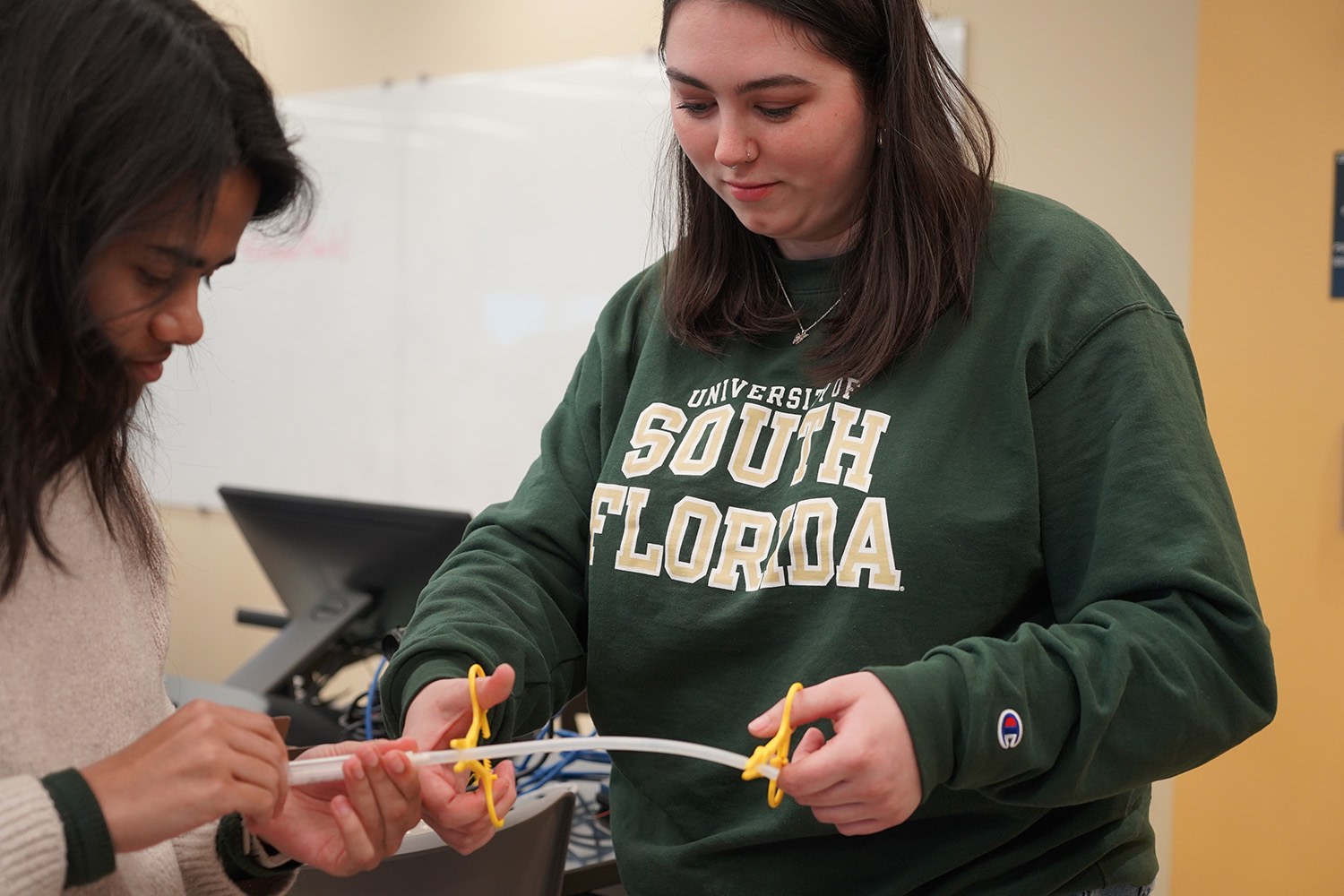 Victoria working on her prototype with her research partner