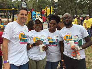 Group poses at Harvest Hope in Tampa