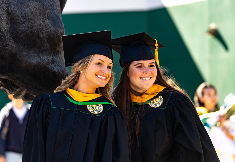 Two students at commencement