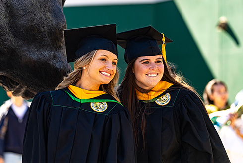 Two students at commencement