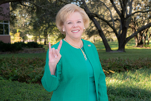 USF President Rhea Law gives the Go Bulls hand sign